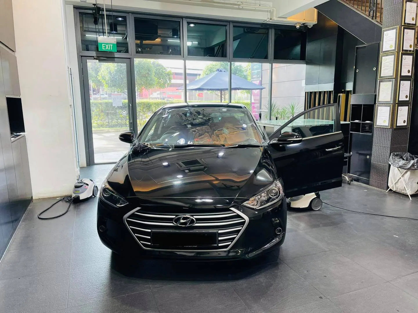 Black Hyundai Elantra viewed head-on inside the Infratint Singapore showroom