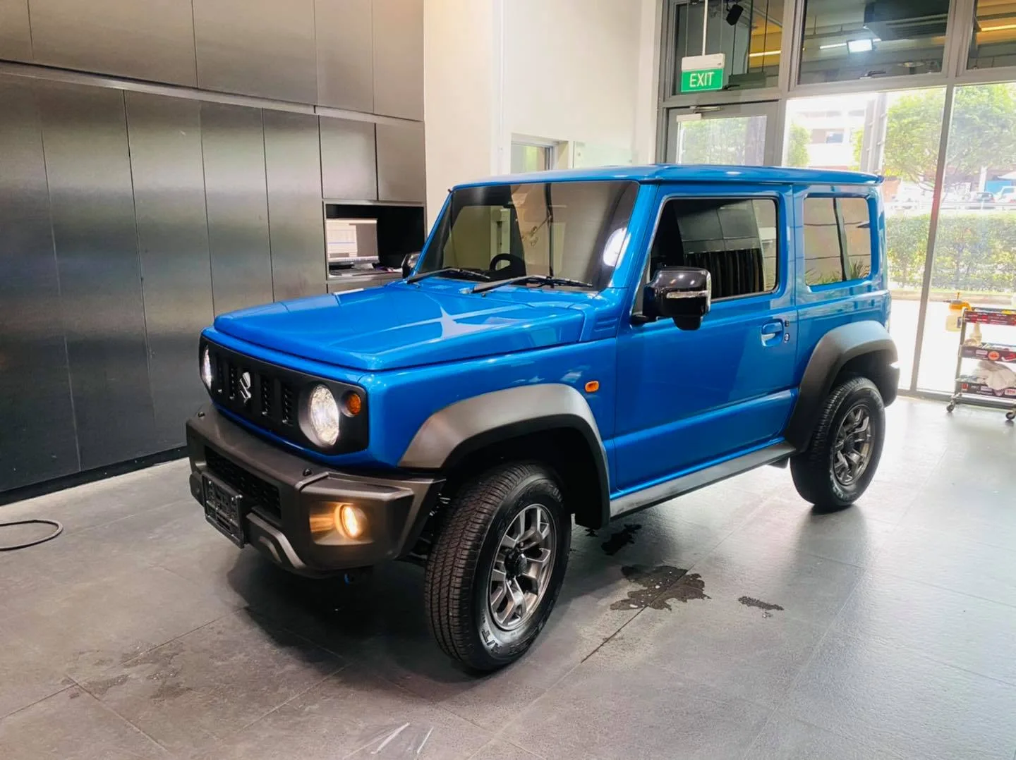 Finished blue Suzuki Jimny with tinted windows at Infratint Singapore