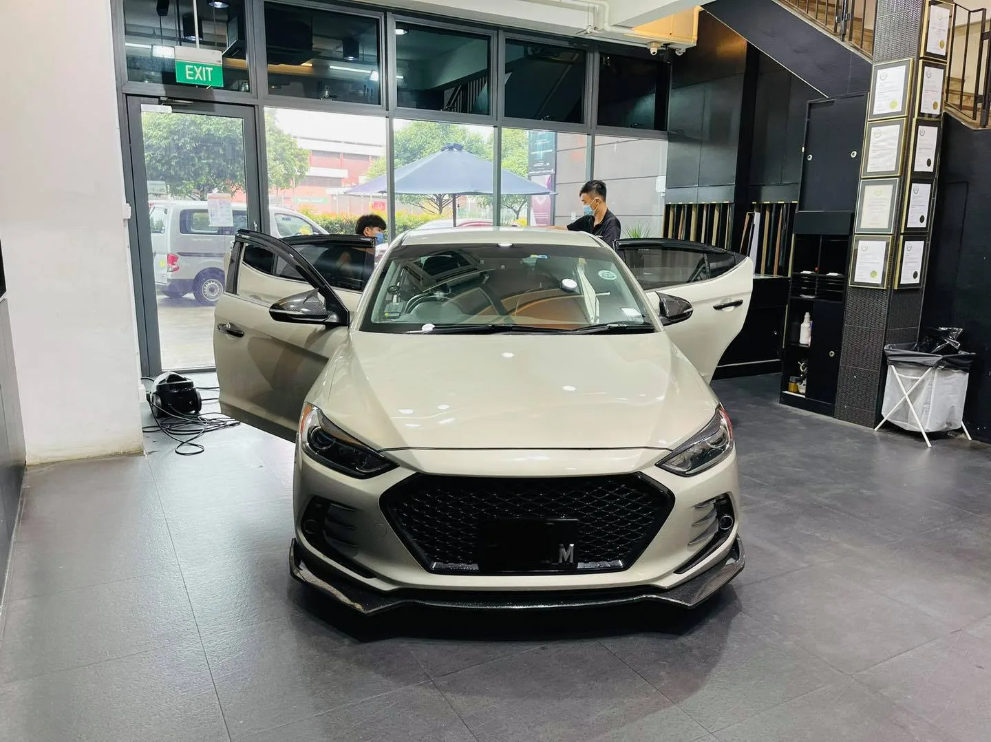 Champagne Hyundai Elantra front view with doors open at Infratint Singapore window tinting