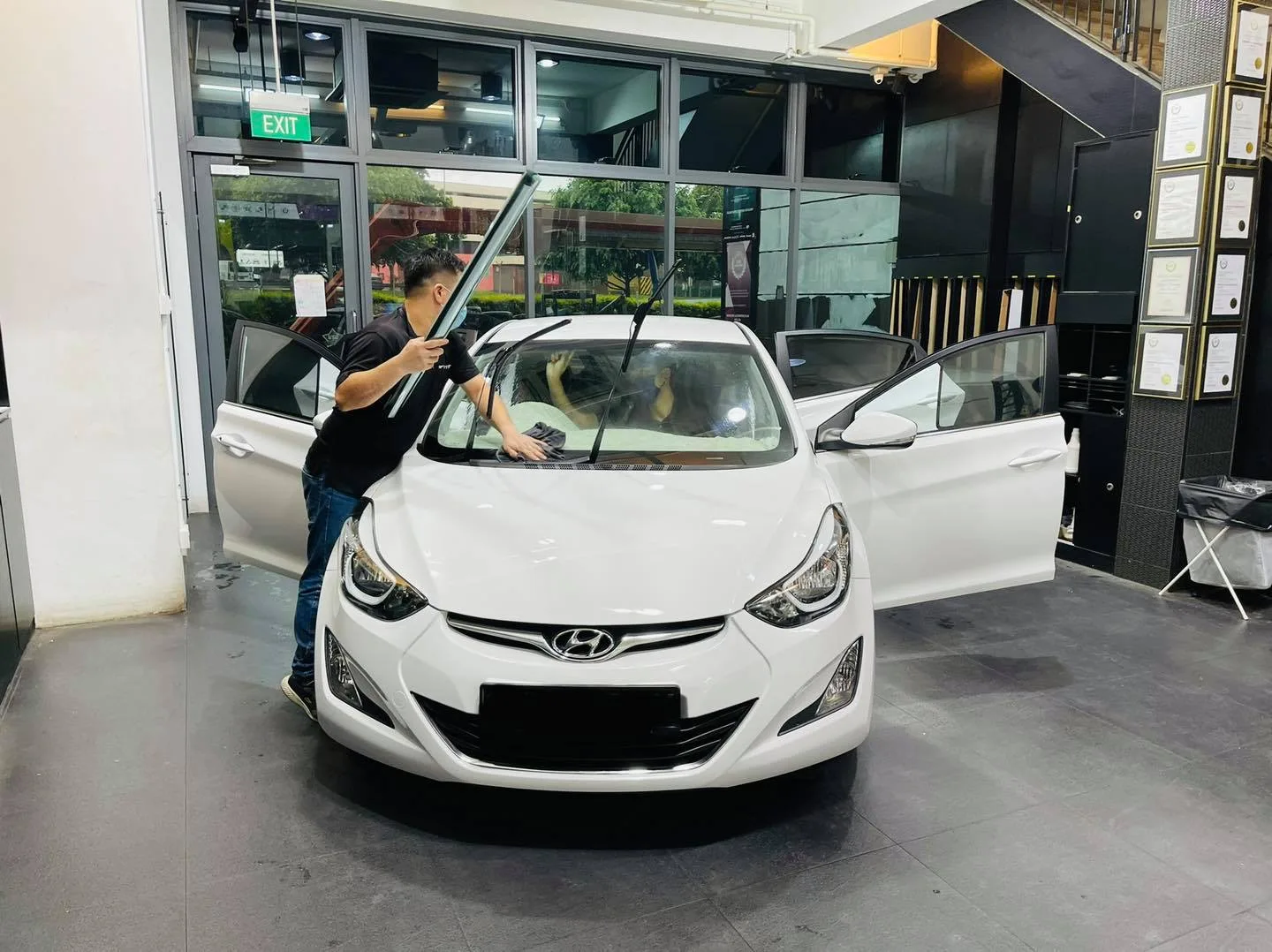 White Hyundai Elantra windscreen being tinted at Infratint Singapore