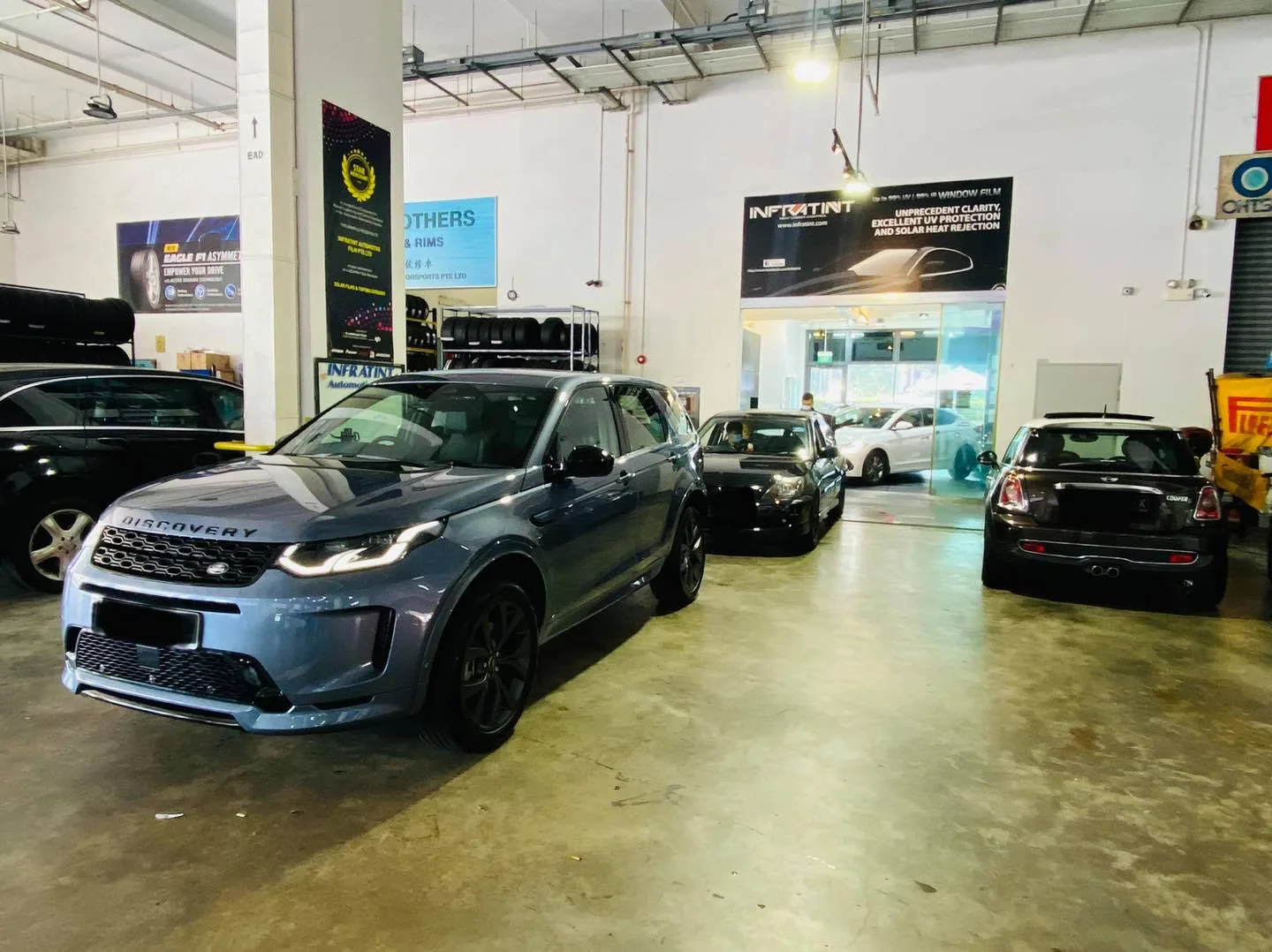Grey Land Rover Discovery SUV at the Infratint Singapore workshop for window tinting