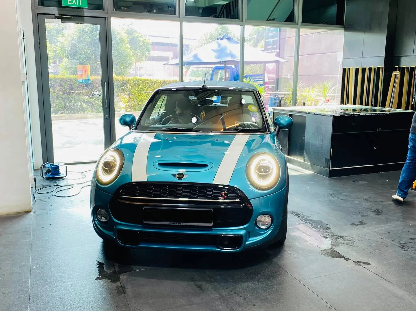 Teal Mini Cooper with white stripes at Infratint Singapore for window tinting