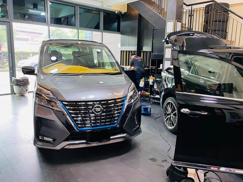 Grey Nissan Serena MPV being prepared for window film at Infratint Singapore