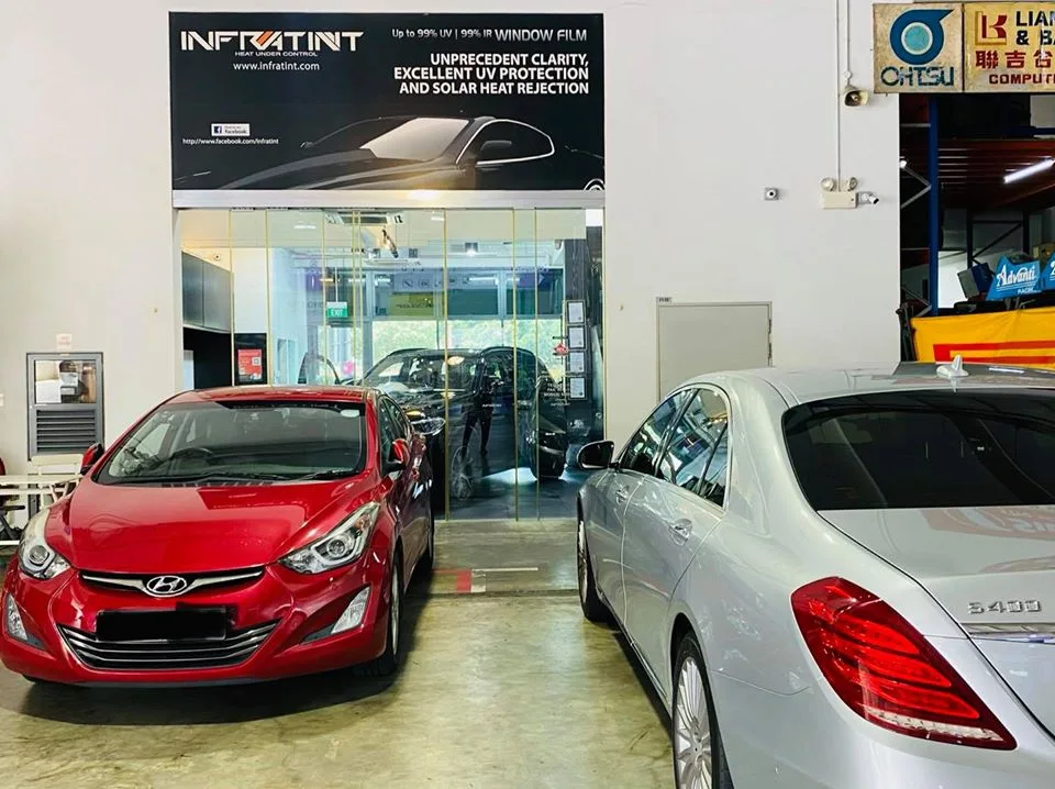 Red Hyundai Elantra and silver Mercedes-Benz S-Class at Infratint Singapore for tinting