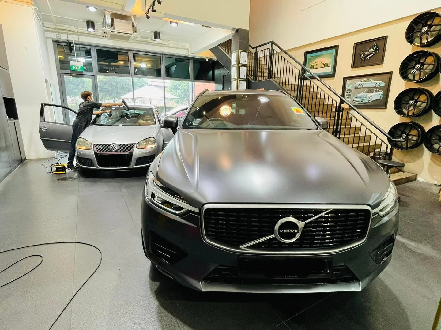 Grey Volvo sedan in the bay during window tinting at Infratint Singapore