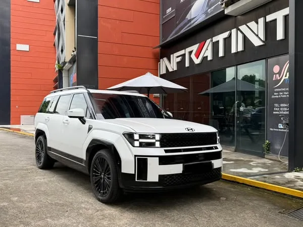 White Hyundai Santa Fe front three-quarter view outside Infratint Singapore