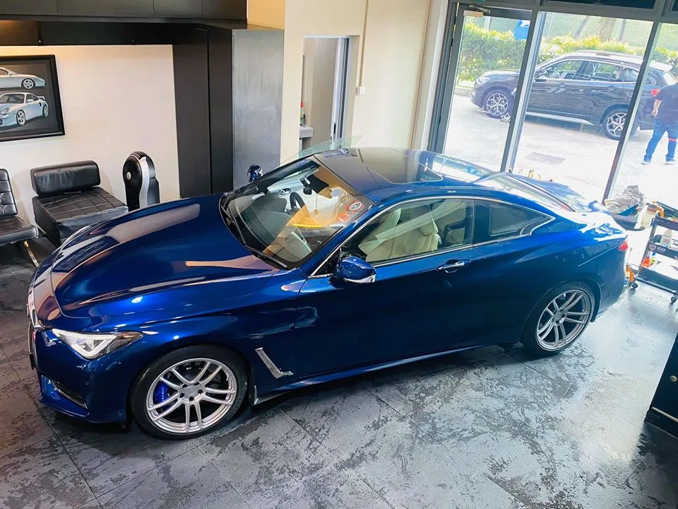 Blue Infiniti Q60 coupe with freshly tinted windows at Infratint Singapore