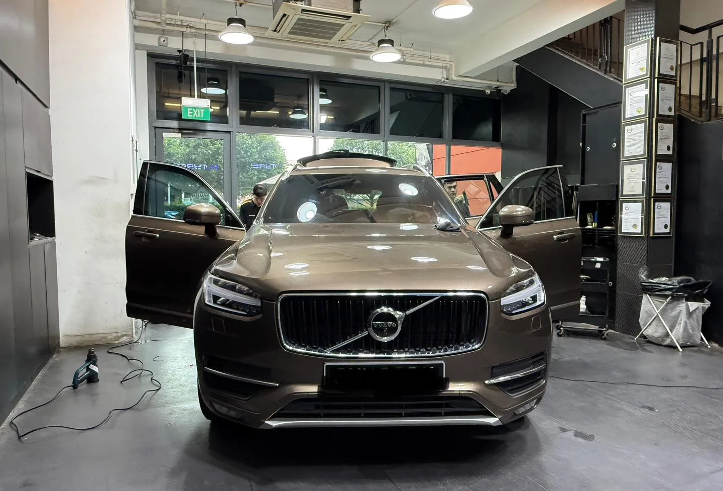 Volvo XC90 inside the Infratint installation bay with doors open