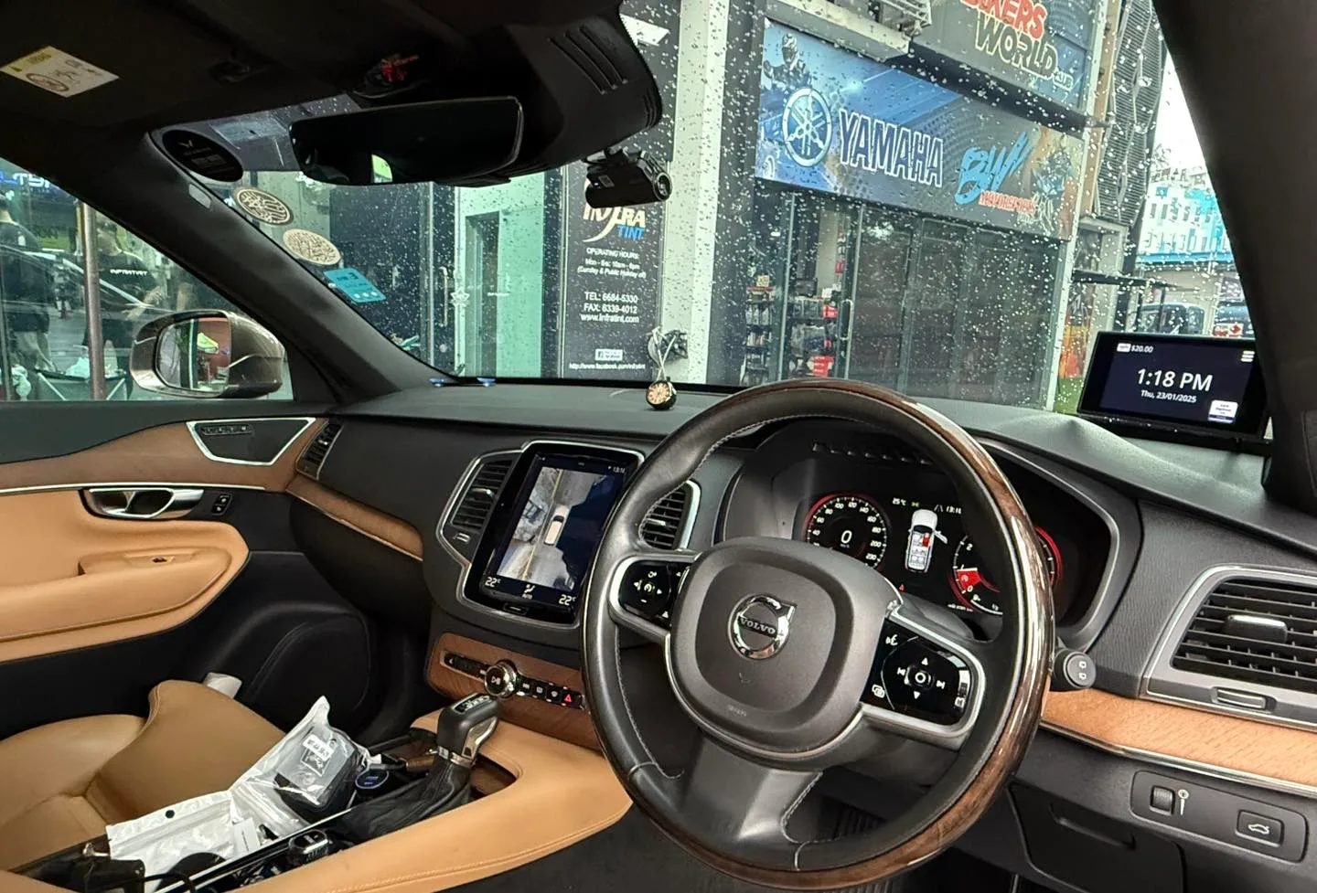 Volvo XC90 tan leather interior seen through tinted glass at Infratint Singapore
