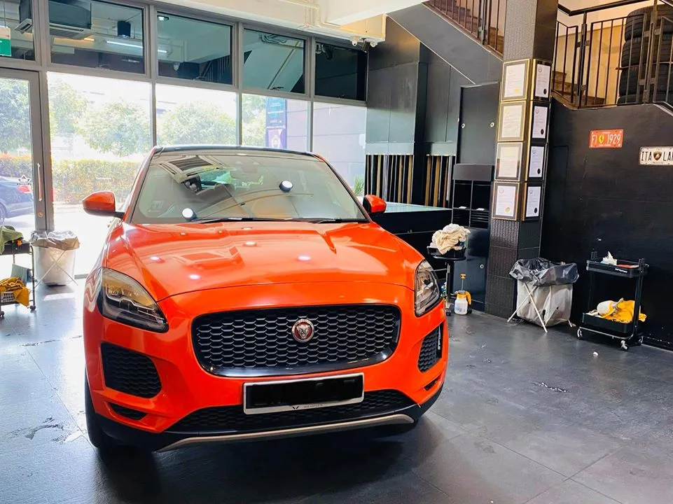 Orange Jaguar E-PACE front view in the install bay at Infratint Singapore