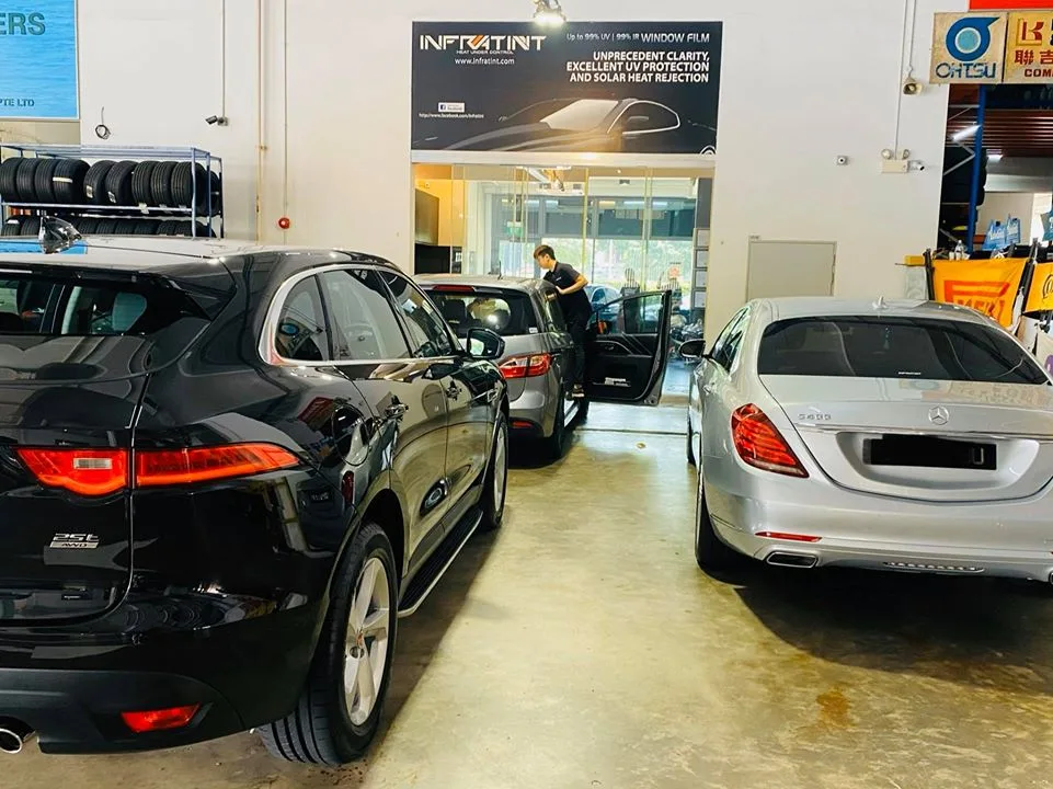 Black Jaguar F-Pace and silver Mercedes-Benz S-Class at Infratint Singapore