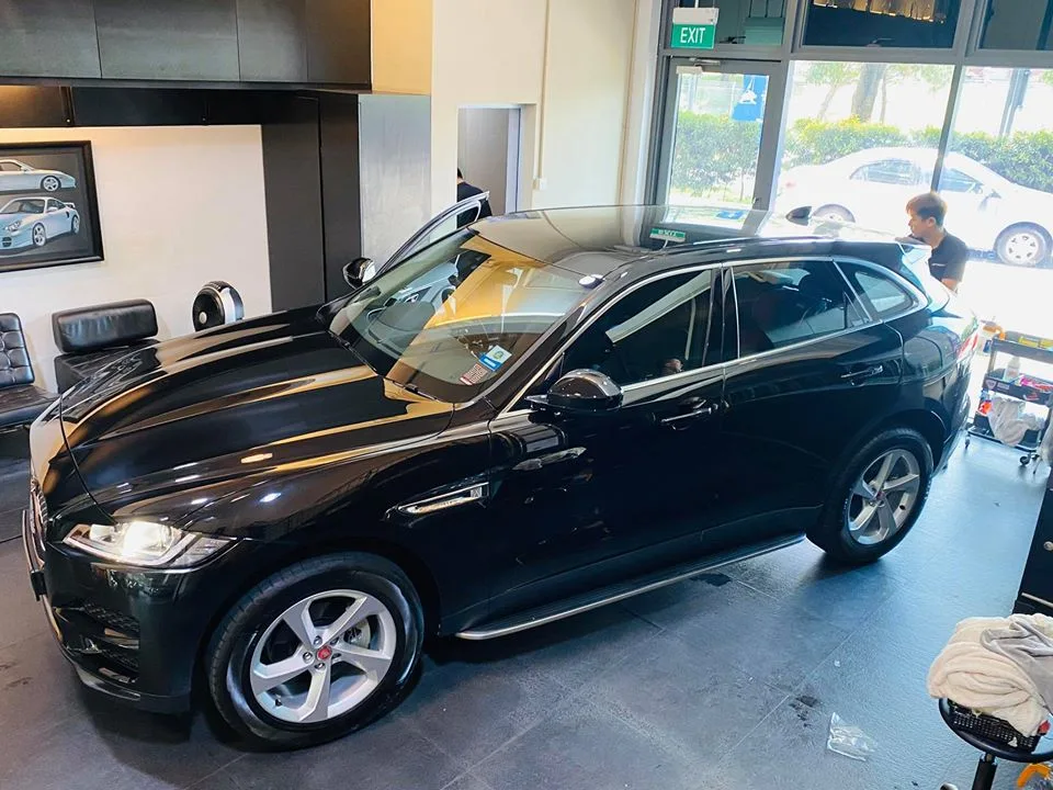 Black Jaguar F-Pace side profile with tinted windows at Infratint Singapore