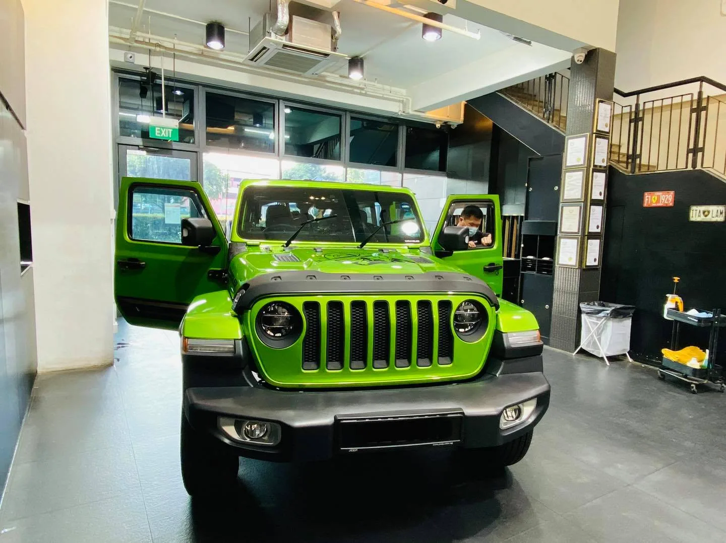 Green Jeep Wrangler front view inside the Infratint Singapore showroom for window tinting