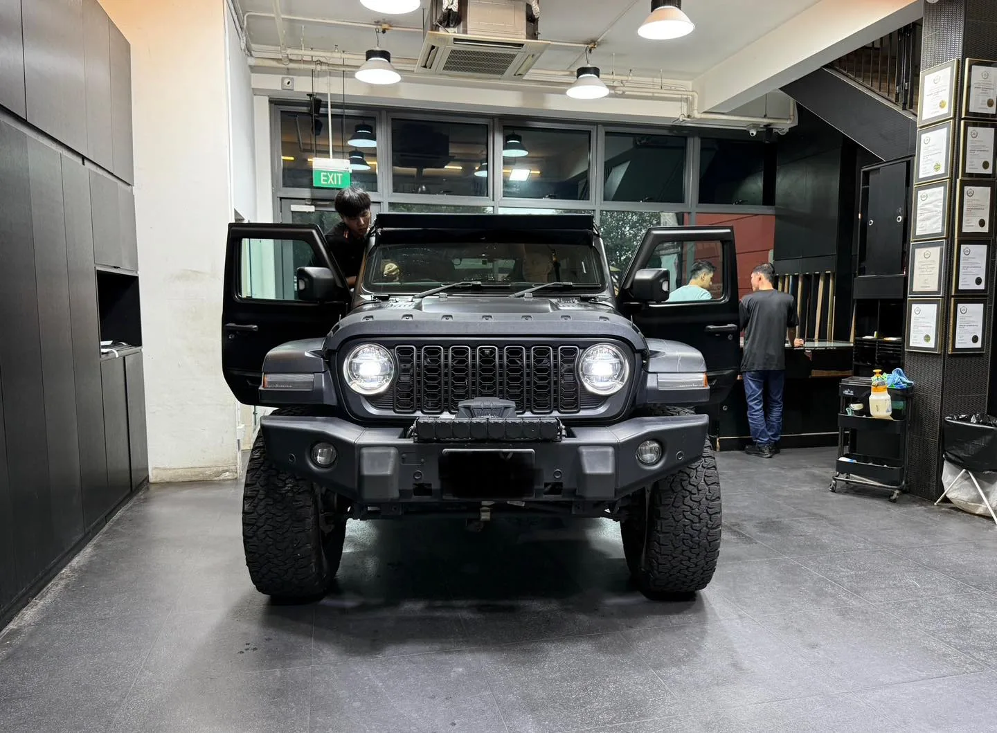 Jeep Wrangler front view inside Infratint Singapore workshop bay during install