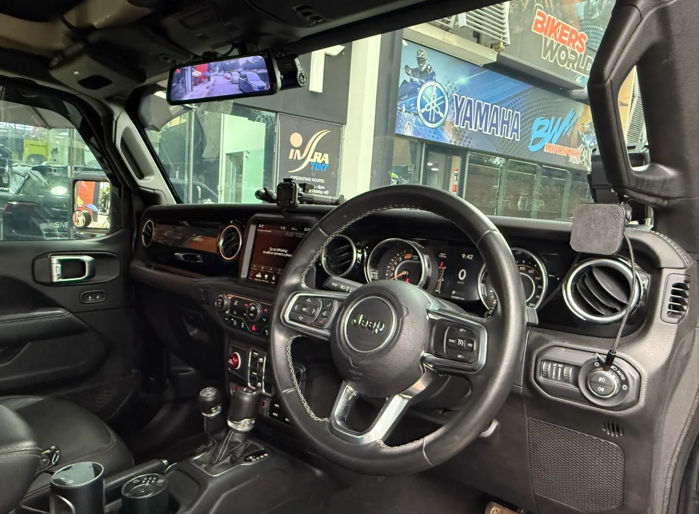 Jeep Wrangler dashboard and steering wheel seen through tinted glass at Infratint Singapore