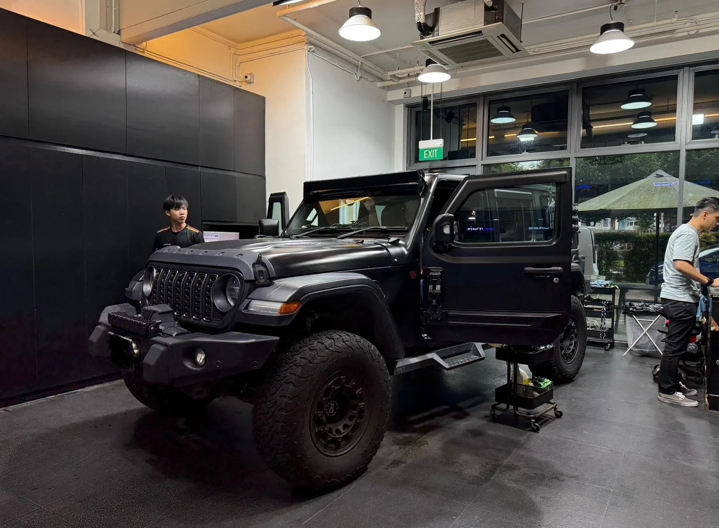 Jeep Wrangler side view inside Infratint Singapore workshop during Platinum99 install