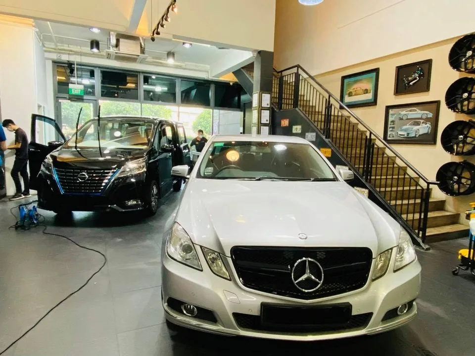 Silver Mercedes-Benz E-Class and black Nissan Serena at Infratint Singapore