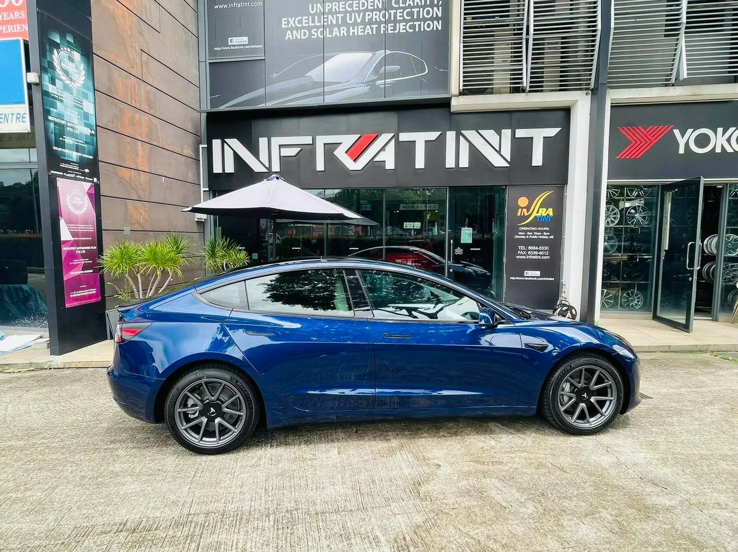 Blue Tesla Model 3 side profile with tinted windows at Infratint Singapore