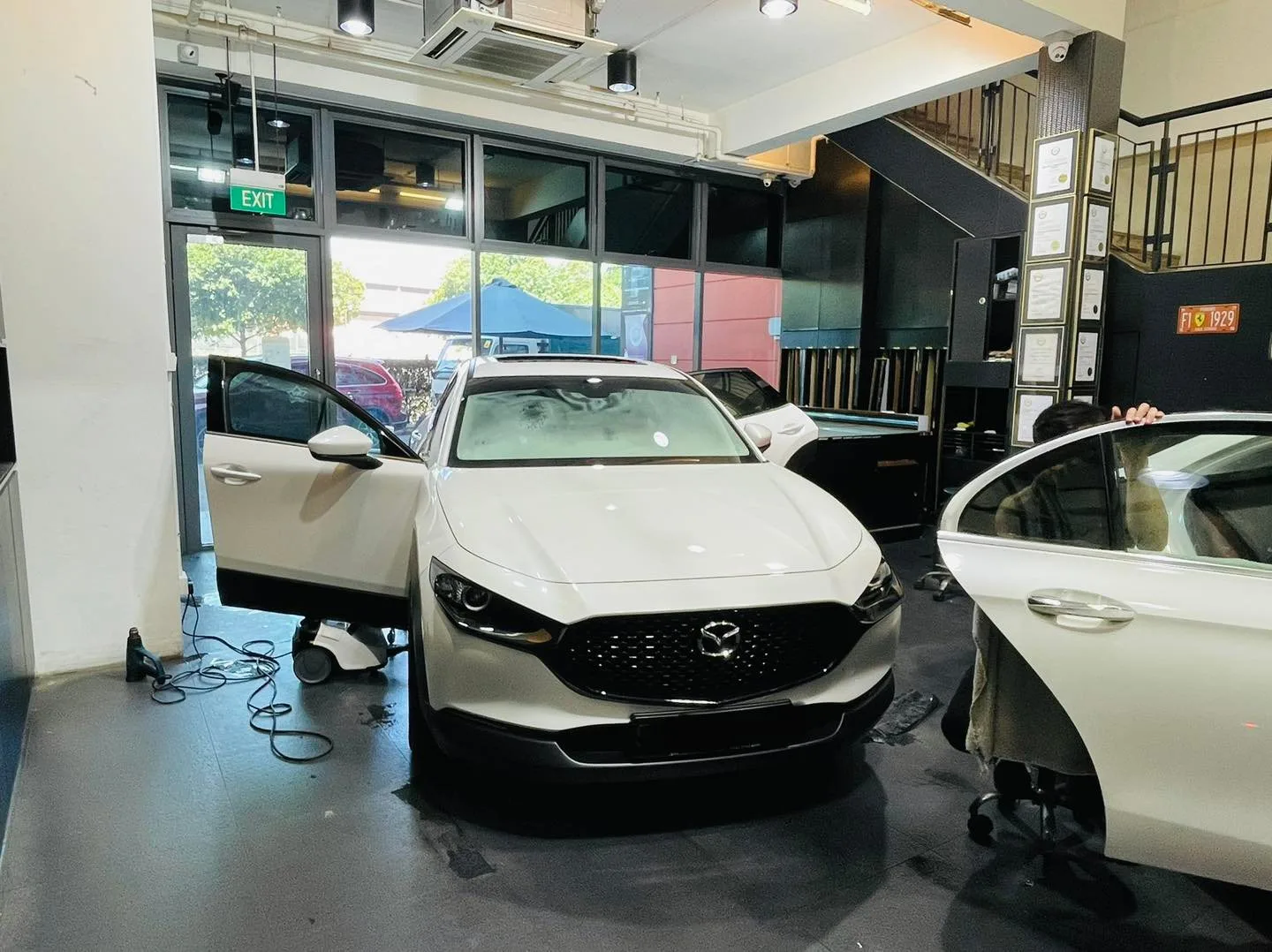 White Mazda CX-30 SUV at Infratint Singapore for window film installation