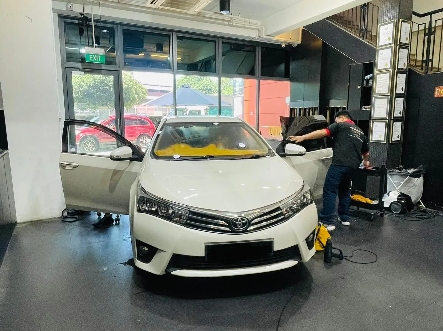 White Toyota Corolla Altis having window film fitted at Infratint Singapore