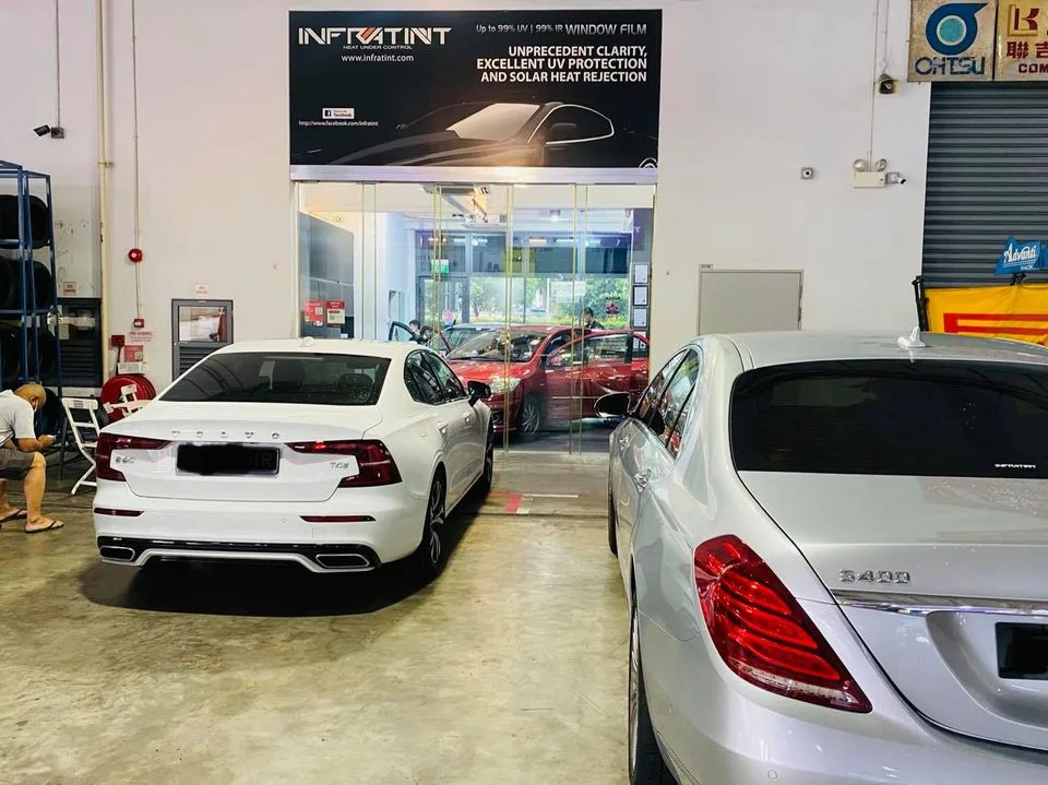 White Volvo S60 and silver Mercedes-Benz S400 from behind at Infratint Singapore