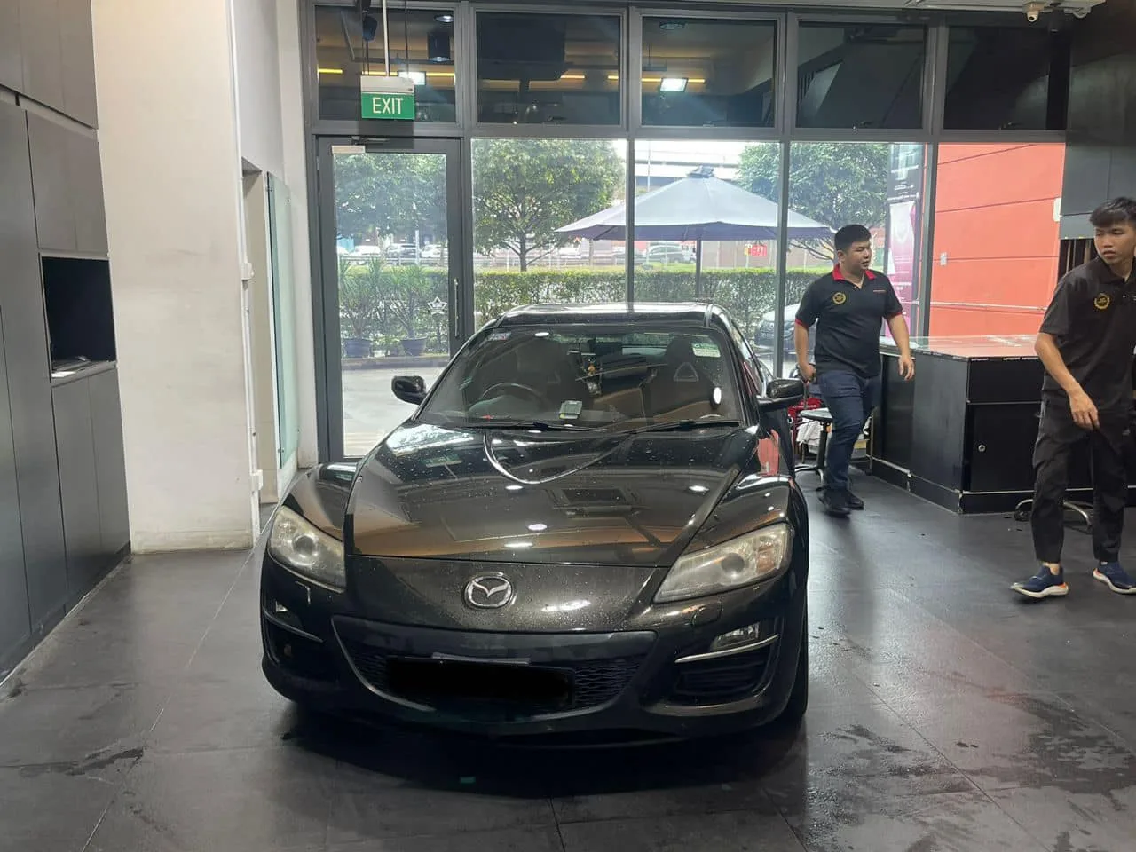 Black Mazda RX-8 at the Infratint Singapore entrance before tinting