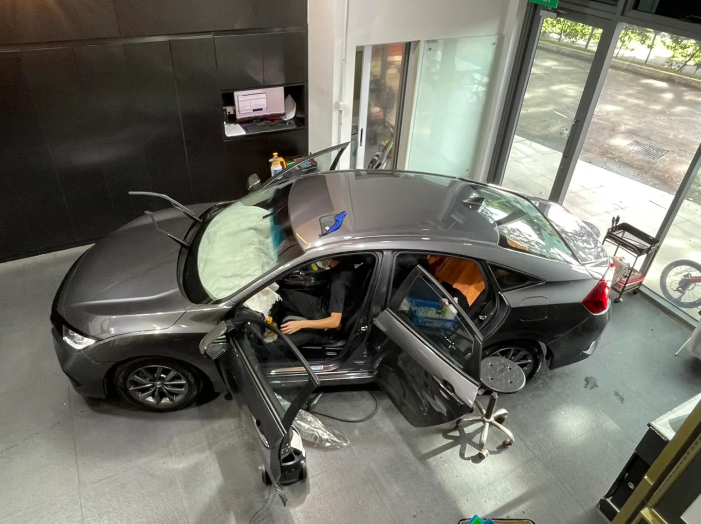 Overhead view of a grey Honda Civic being tinted at Infratint Singapore
