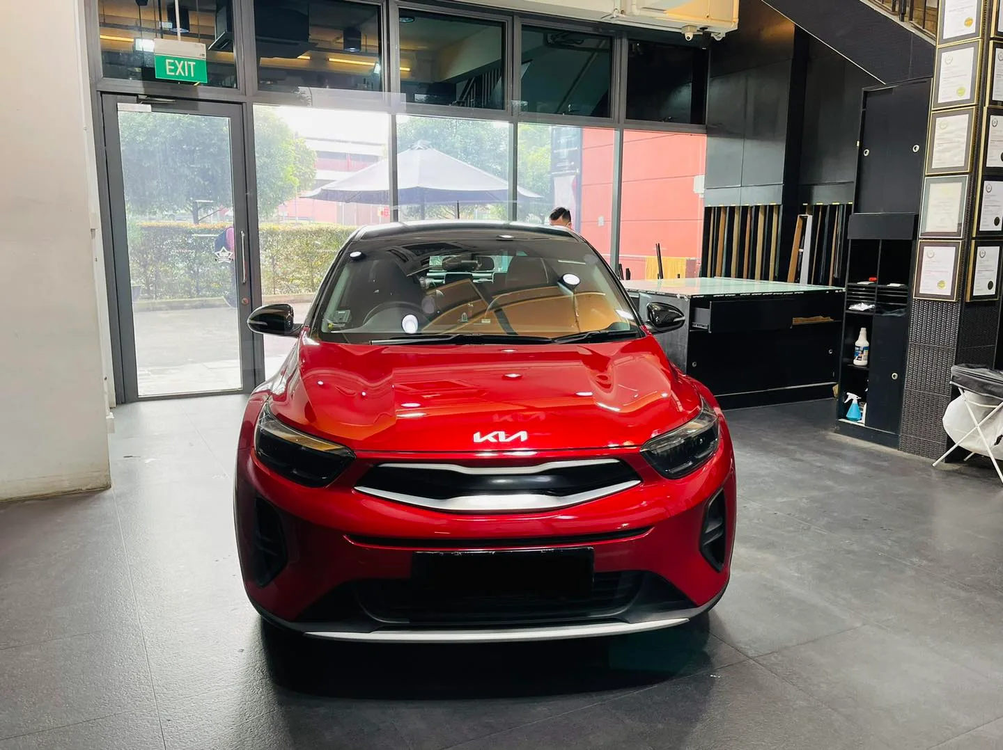 Red Kia Stonic crossover front view at Infratint Singapore for window film