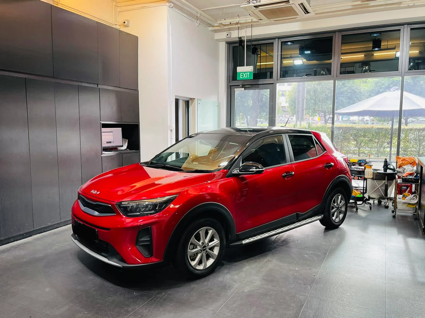 Red Kia Stonic crossover three-quarter view at Infratint Singapore