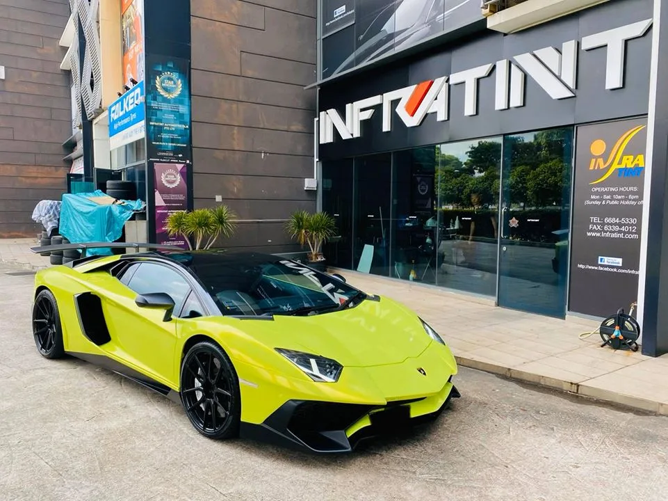 Lime green Lamborghini Aventador parked outside Infratint Singapore for window tinting