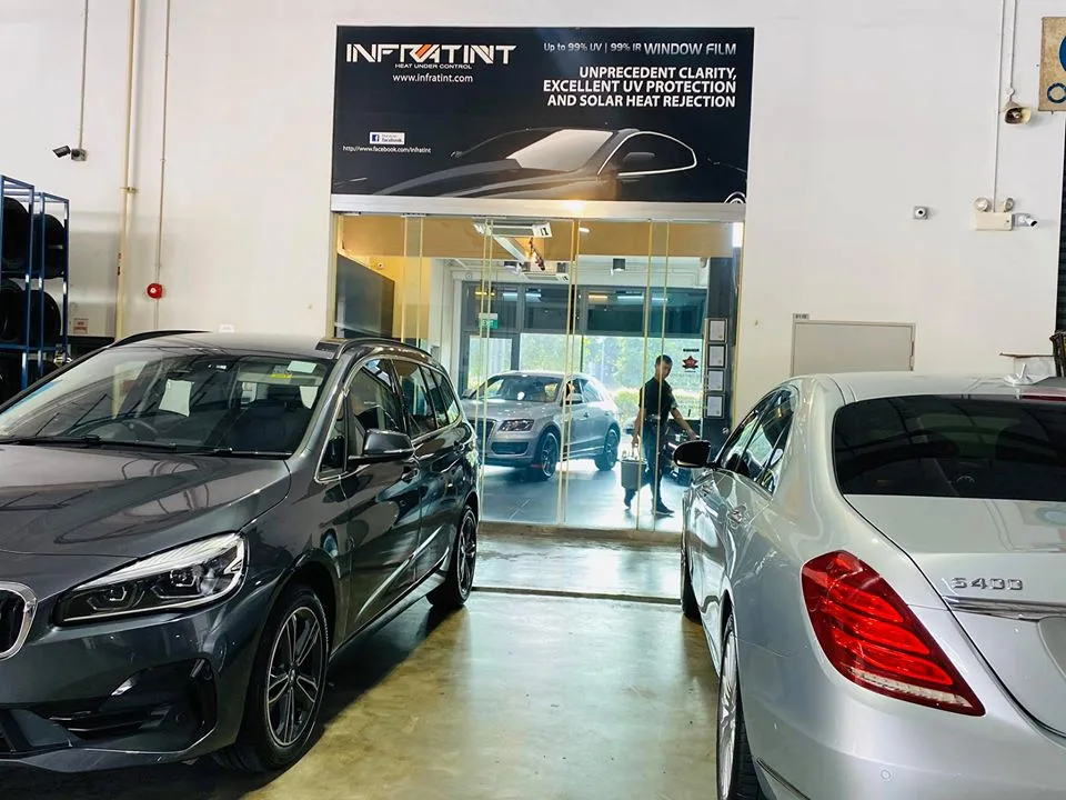 Grey BMW and silver Mercedes-Benz waiting for window tinting at Infratint Singapore