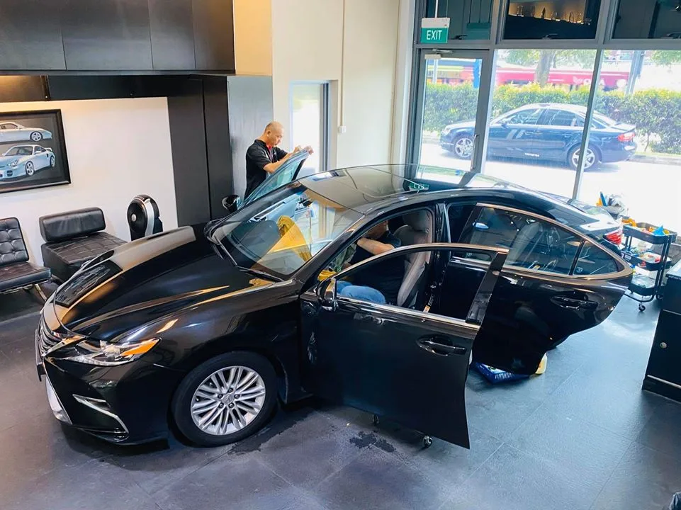 Black Lexus ES sedan having its windscreen tinted at Infratint Singapore