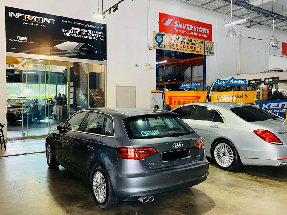 Grey Audi A3 and silver Mercedes-Benz sedan at Infratint Singapore for window tinting