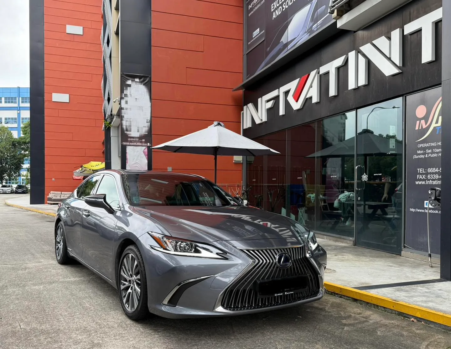 Grey Lexus ES300h front three-quarter view outside Infratint Singapore
