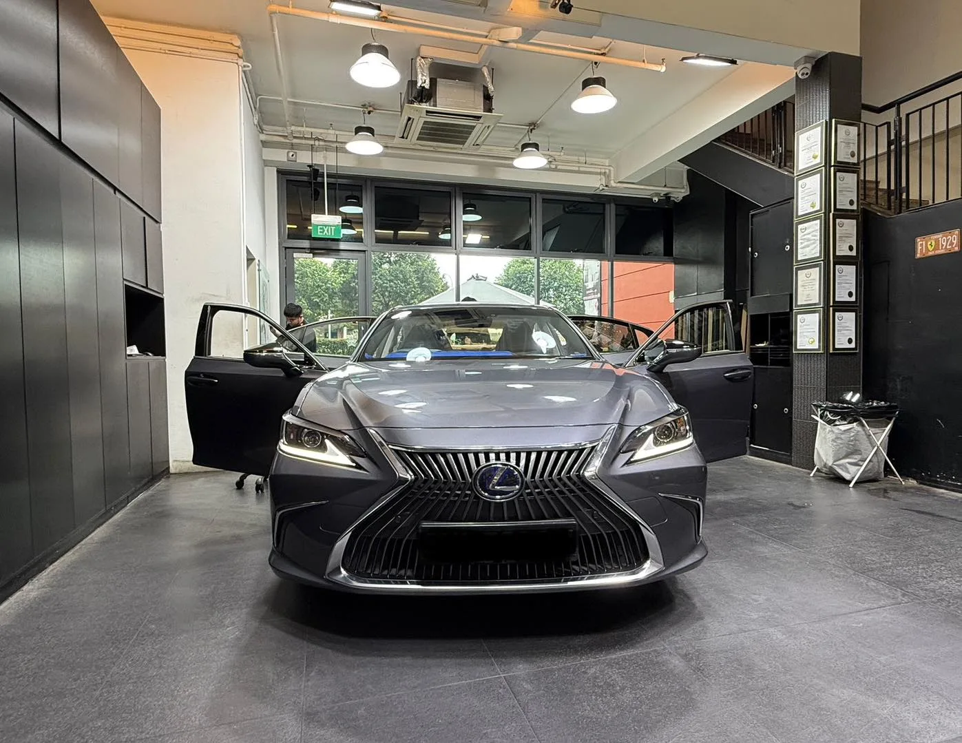 Grey Lexus ES300h front view inside the Infratint workshop