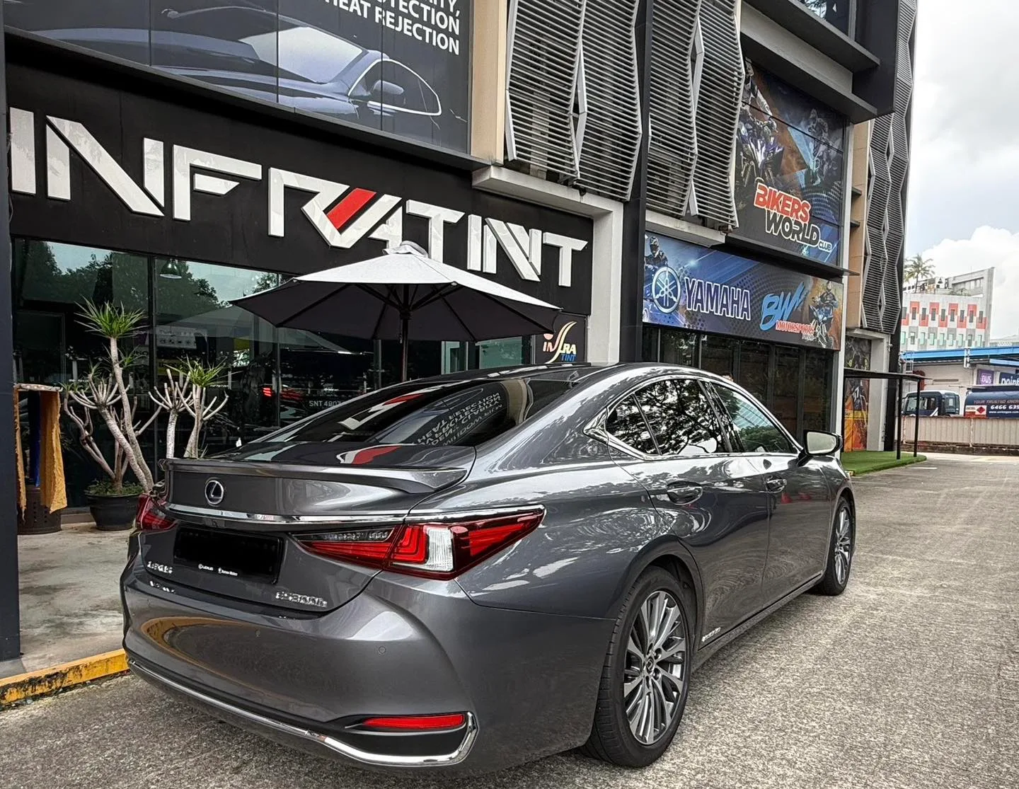 Grey Lexus ES300h rear three-quarter view with tinted windows at Infratint Singapore