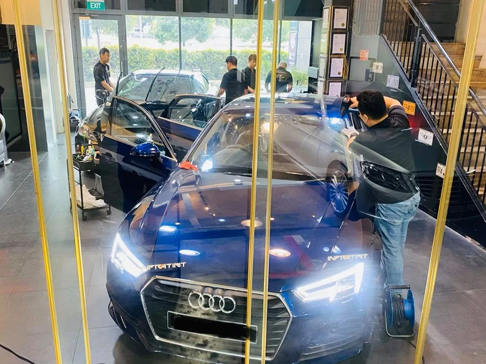 Blue Audi A4 sedan having window film installed at Infratint Singapore