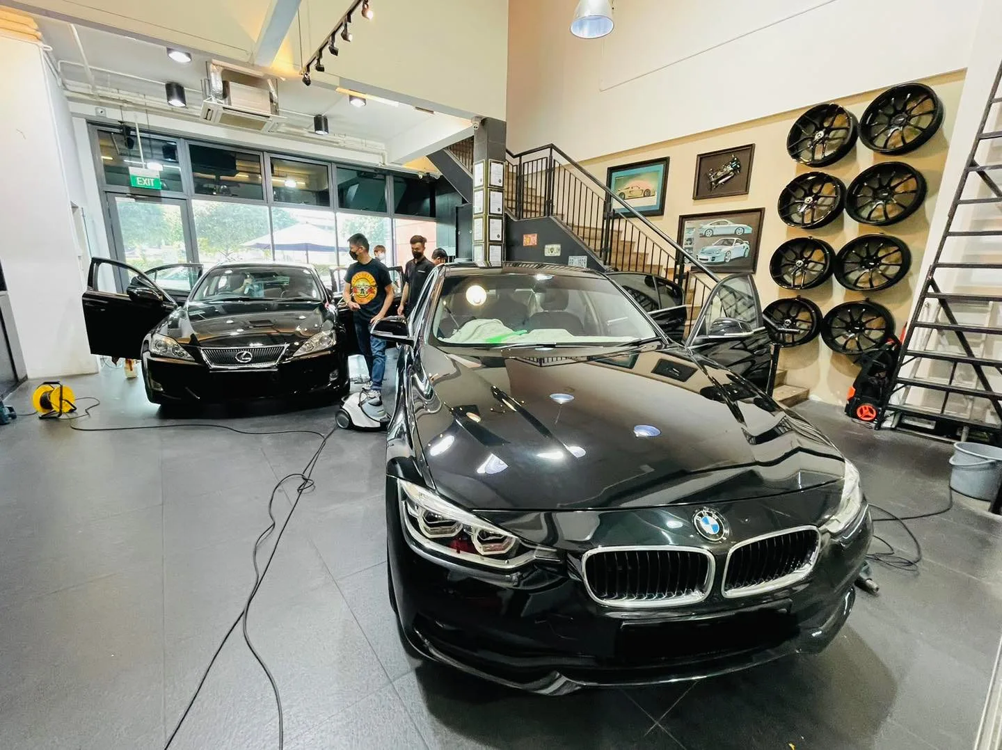 Black BMW 3 Series with a Mercedes-Benz SUV being tinted at Infratint Singapore