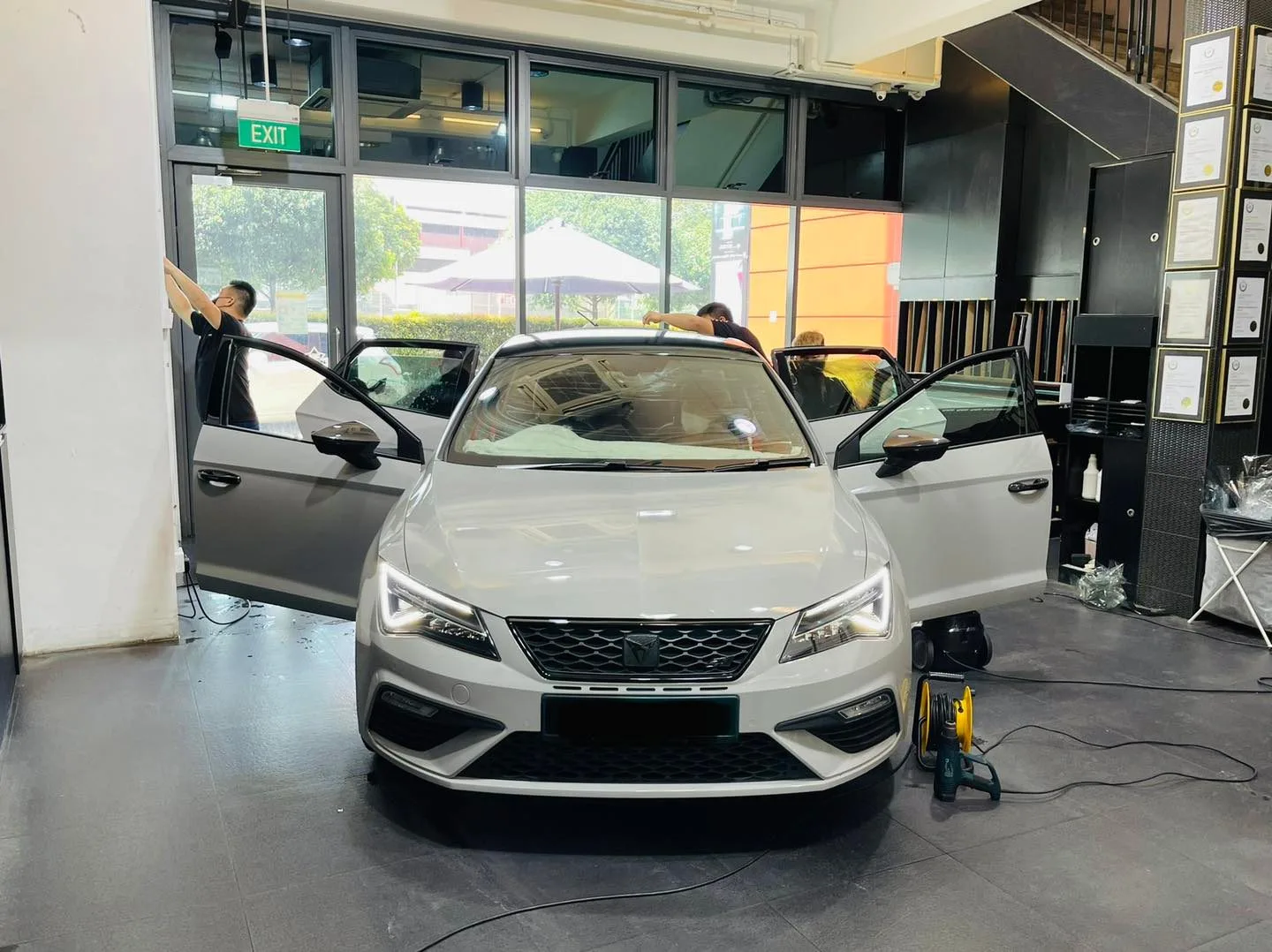Grey Cupra hatchback having windows tinted at Infratint Singapore