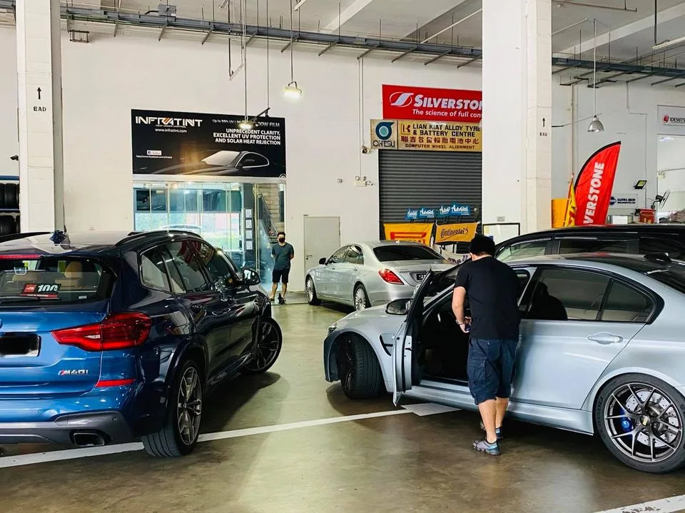 Blue BMW X3 M40i, silver Mercedes-Benz CLS and a BMW M3 at Infratint Singapore