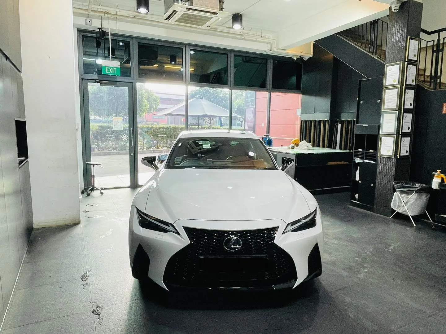 Front head-on view of a white Lexus IS sedan at Infratint Singapore