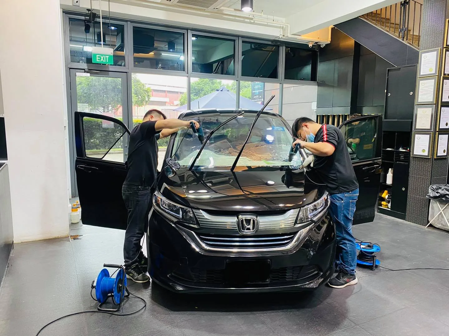 Black Honda MPV having its windows tinted at Infratint Singapore