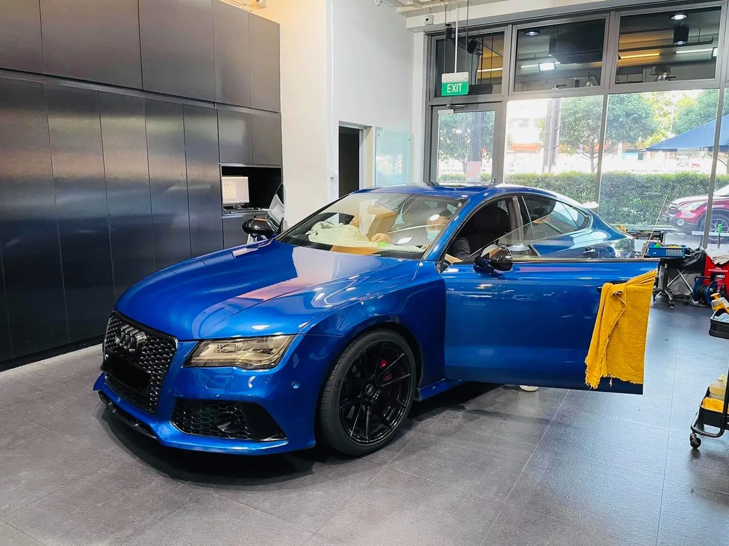 Blue Audi RS7 Sportback in front three-quarter view at Infratint Singapore for tinting