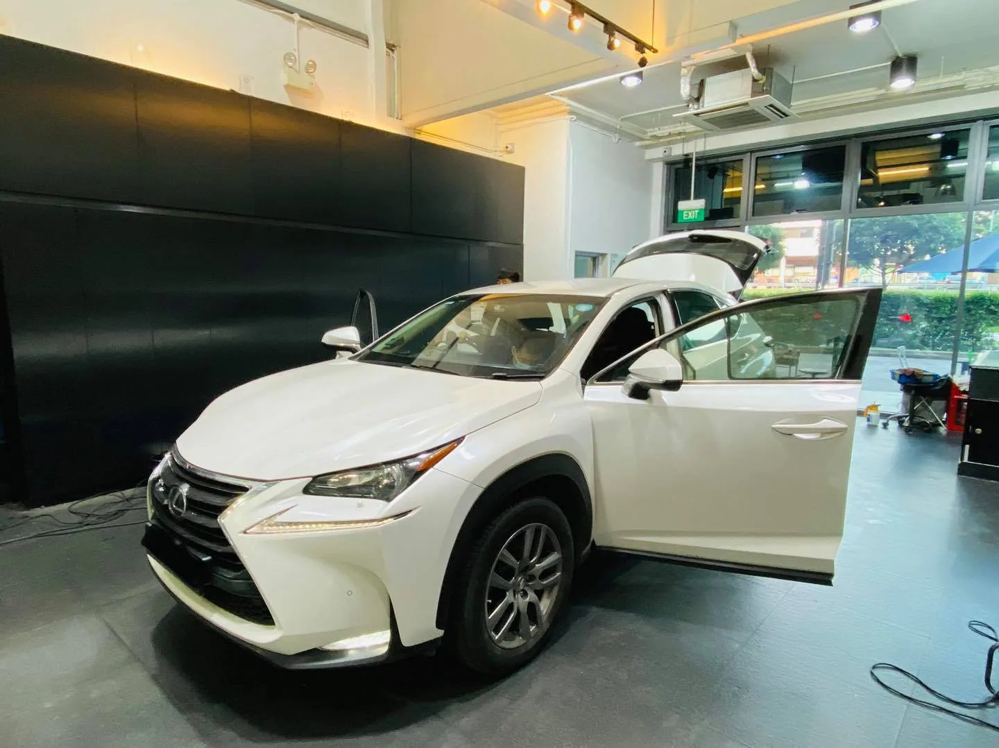 White Lexus NX SUV with tailgate up at Infratint Singapore for window film