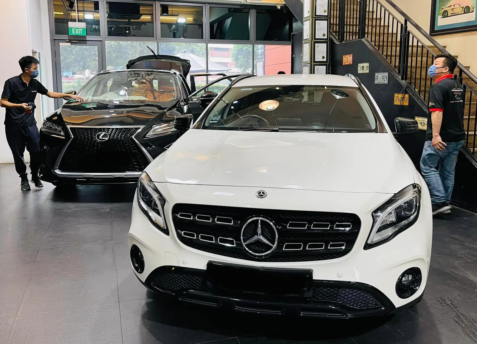 Black Lexus SUV and white Mercedes-Benz GLA in the showroom at Infratint Singapore
