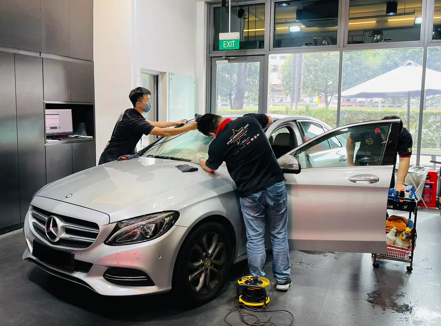 Silver Mercedes-Benz sedan side glass being tinted at Infratint Singapore