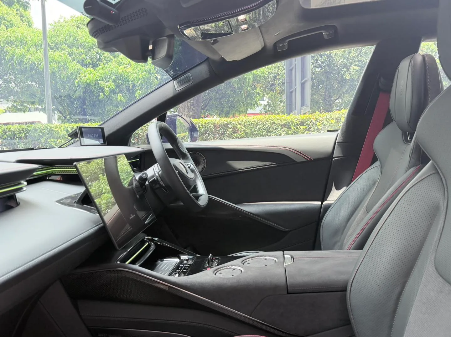 Lotus Eletre interior and dashboard display seen through tinted glass at Infratint Singapore