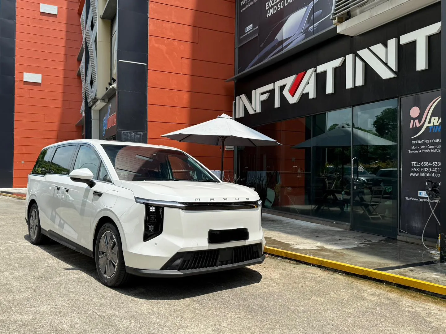 White Maxus MIFA 7 front three-quarter view outside Infratint Singapore