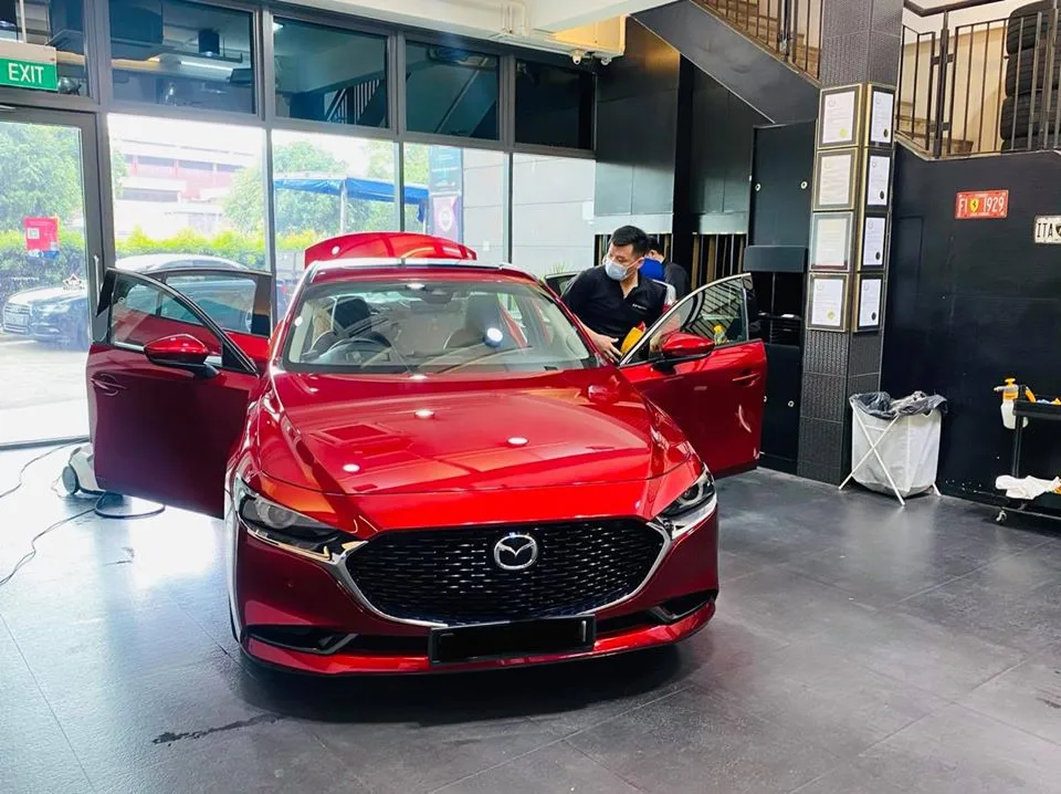 Red Mazda 3 having window film installed at Infratint Singapore