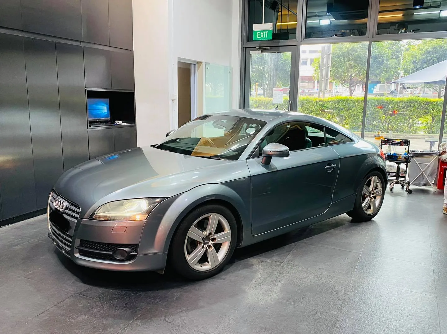 Grey Audi TT coupe at a front three-quarter view at Infratint Singapore